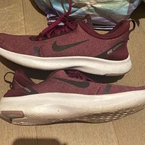 Maroon Nike running sneakers